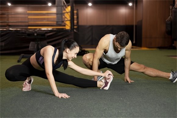 Two people engaged in functional mobility training exercises